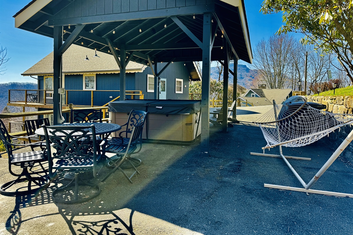 Patio w/ Views: Dining for 6, Big Premium Hot Tub, Fire Pit Table w/ Polywood Adirondack Chairs, a Hammock, extra seating & Outdoor Games. Formerly our carport - there's still room to park 4 cars