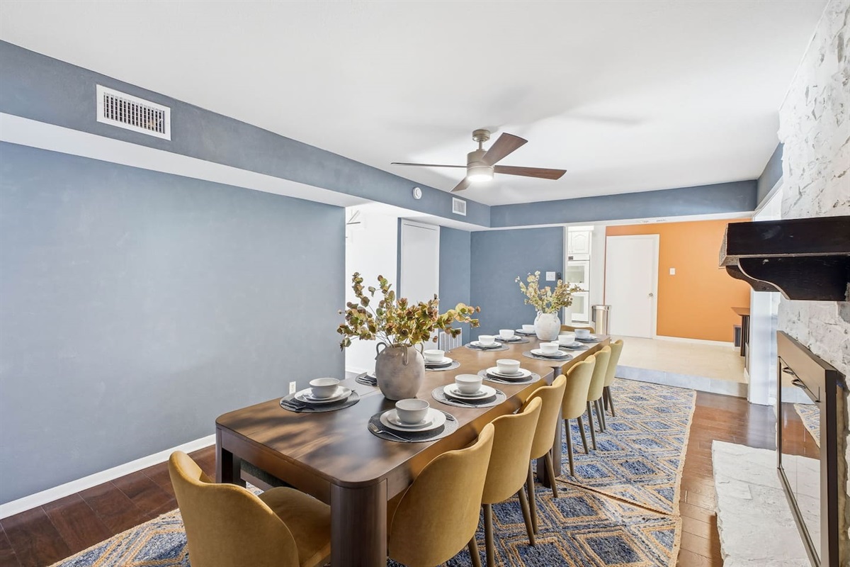 Dining table seating 14, with the kitchen and breakfast nook in the background