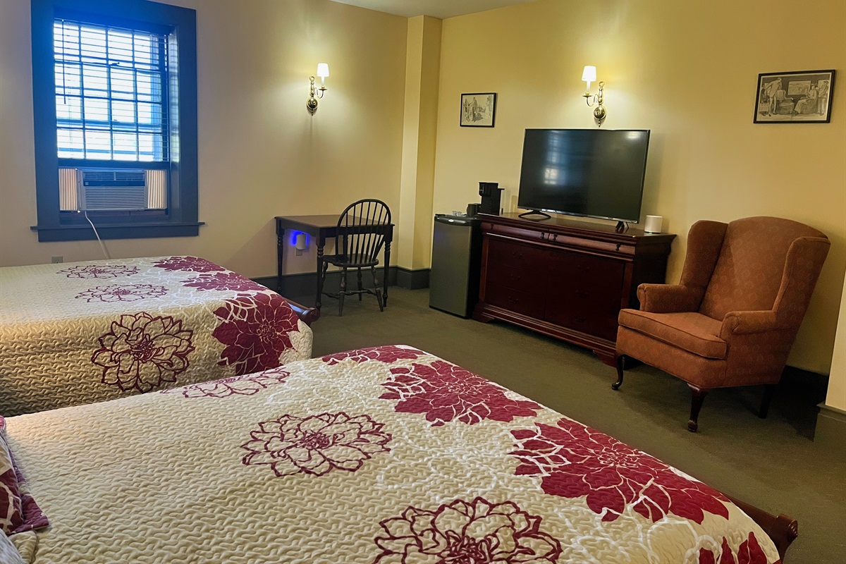 Guest room #5 with Roku TV and mini fridge.