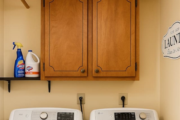 In-home laundry cabinet includes supplies and storage — ready for long stays or weekend refreshes.