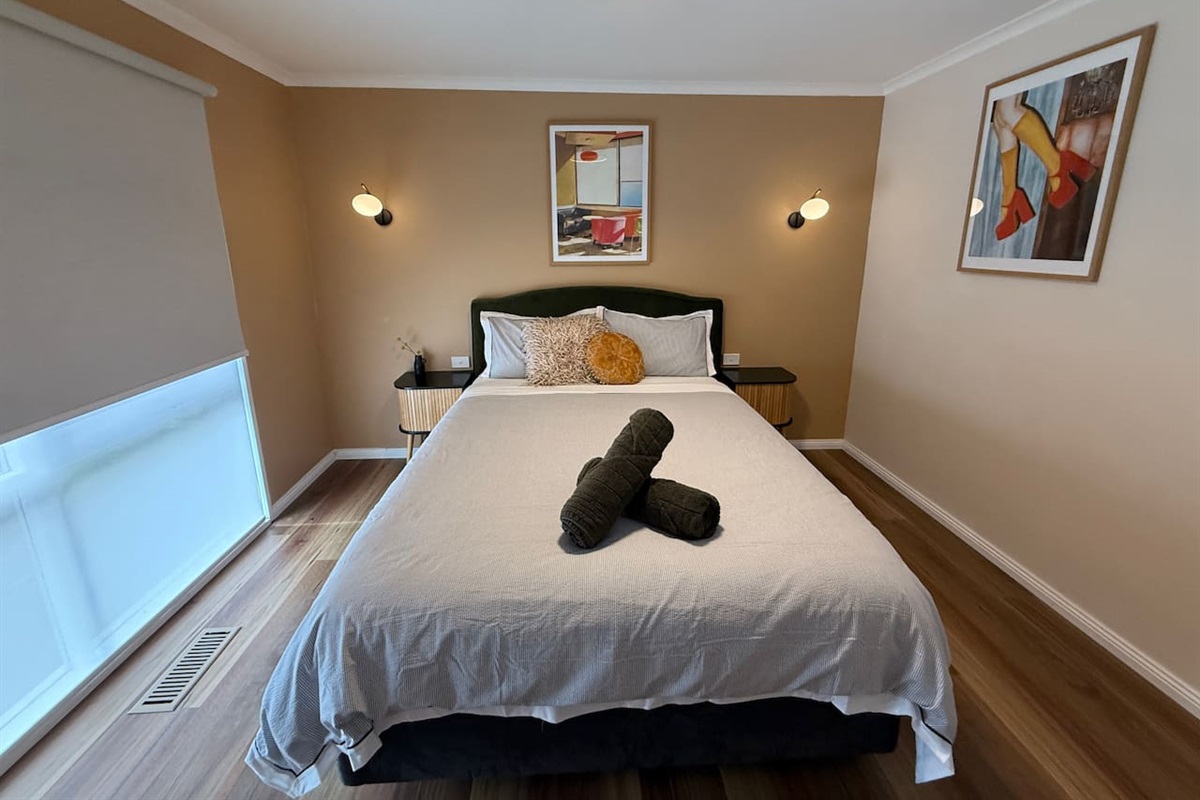 The Queen bedroom is a beautiful peaceful space, also with high thread count bedding, motorised blinds and large cupboards. Very effective ducted heating and cooling ensures you're always comfortable in any room.
