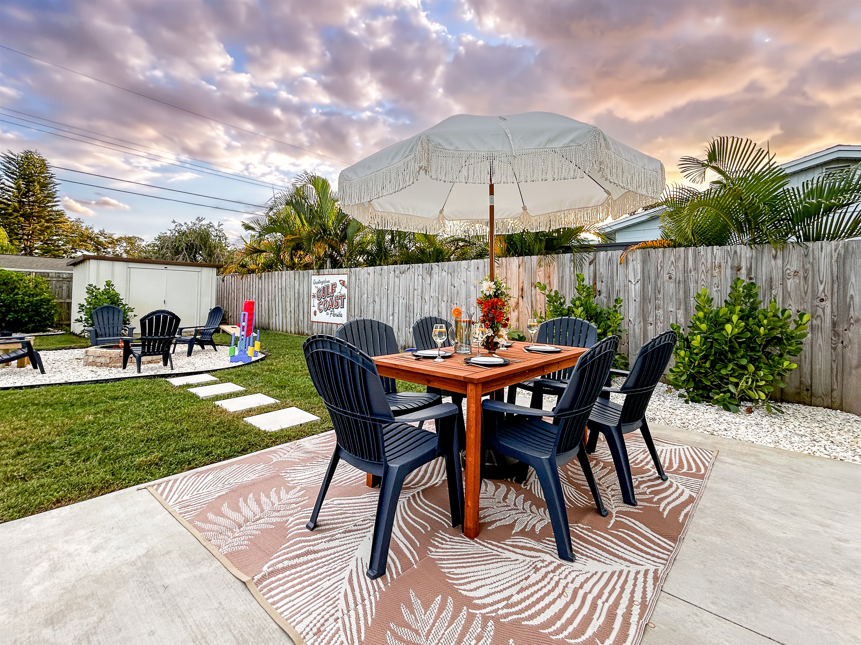 Back Yard with Local Artist Mural, Patio Table, Fire Pit, & More