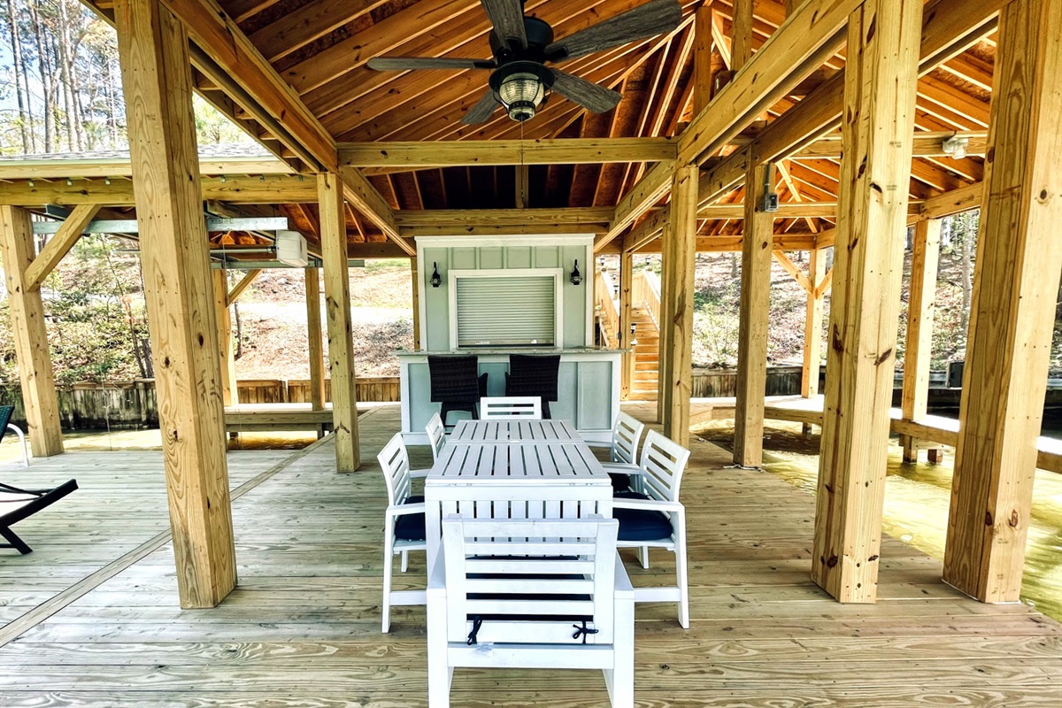 Dining table, bar with fridge and shed