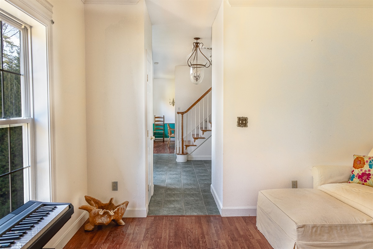 Complete the circle of the main floor with this view from the Driftwood Den through the tiled foyer and into the formal dining room. This intuitive flow paired with cozy reading nooks, makes Seven Peaks Ridge feel both spacious and connected for your group