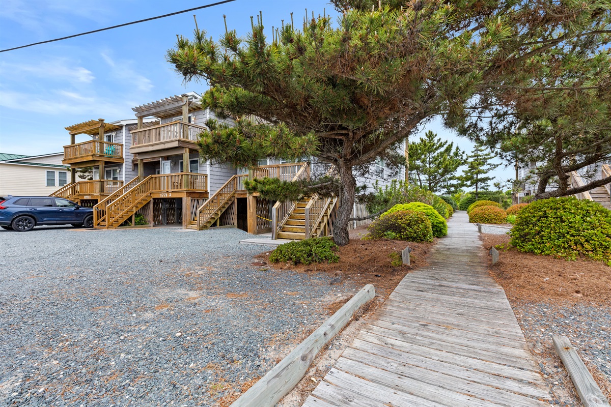 Quiet community setting with lush greenery and coastal charm