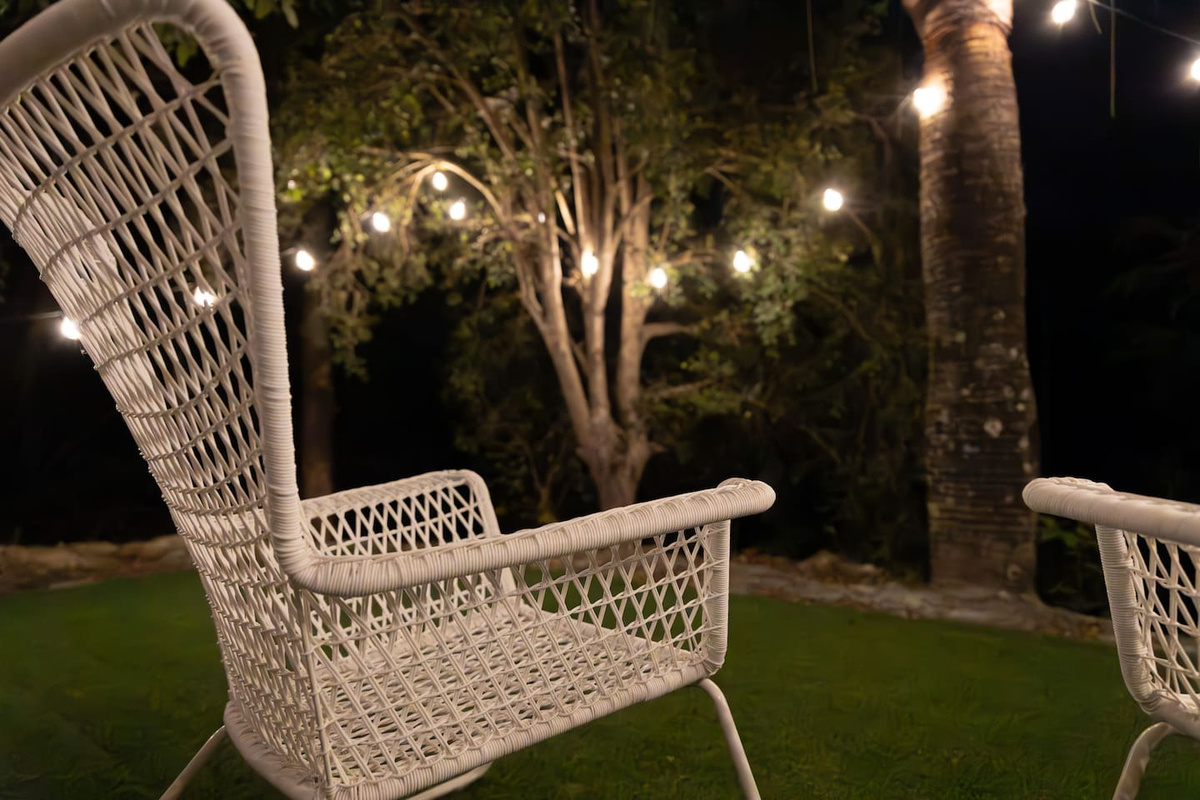 Your private outside area at night. A wonderful place to relax. The white fence has since been added after this photo was taken