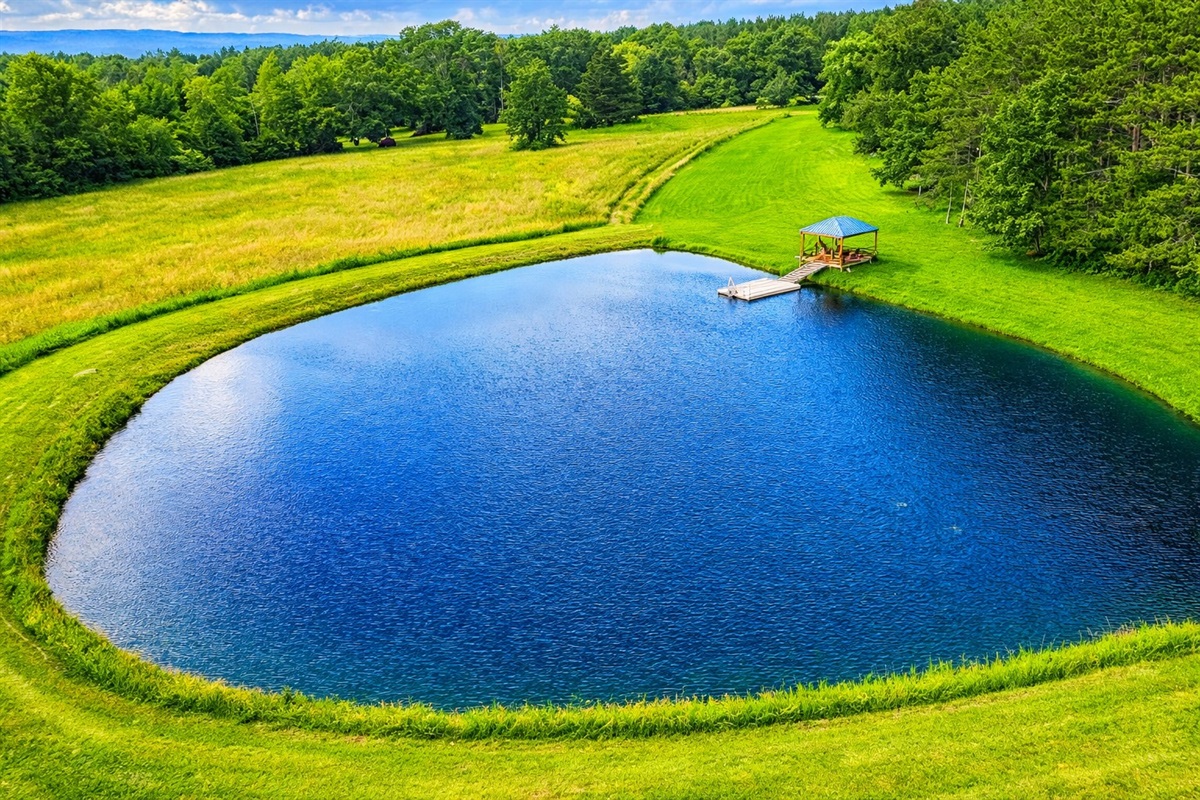 Tranquil waterside retreat featuring a dock and gazebo—ideal for morning coffee, sunset views, or lakeside gatherings.