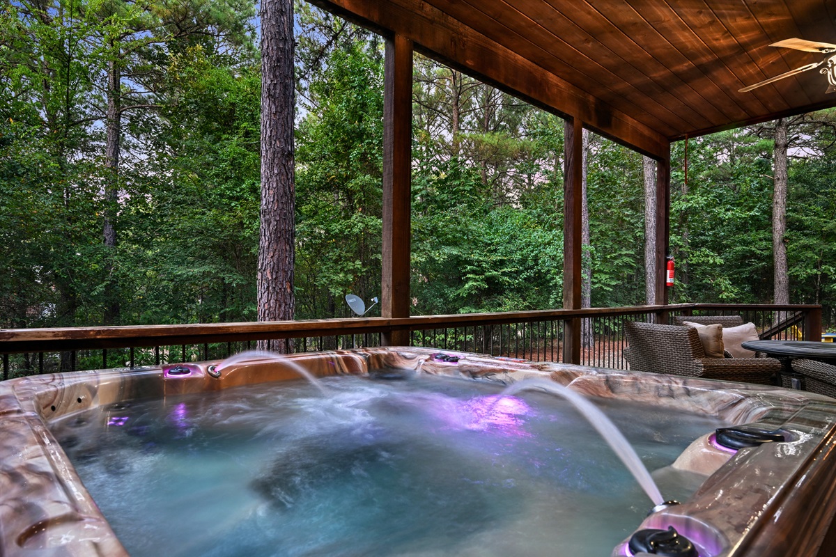 Relax in the private hot tub surrounded by trees and mountain air—an ideal way to end the day under the stars.