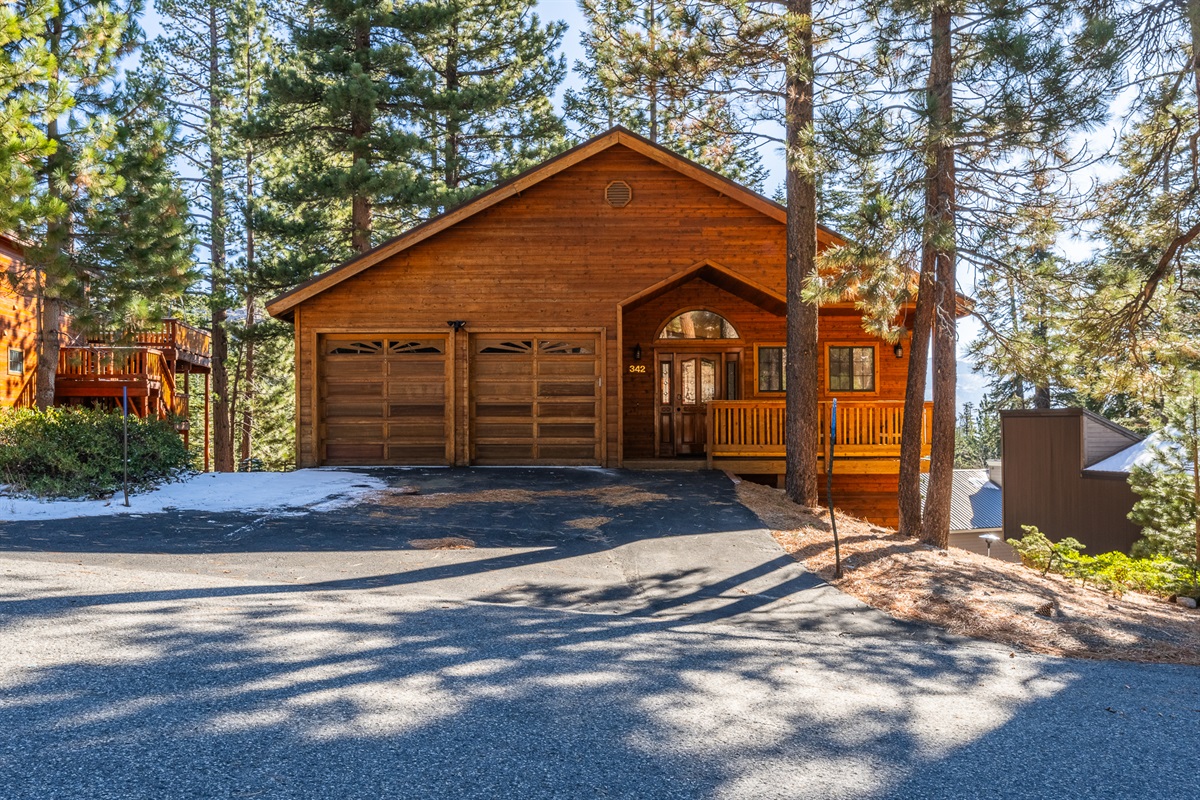 Driveway and lit path to the home