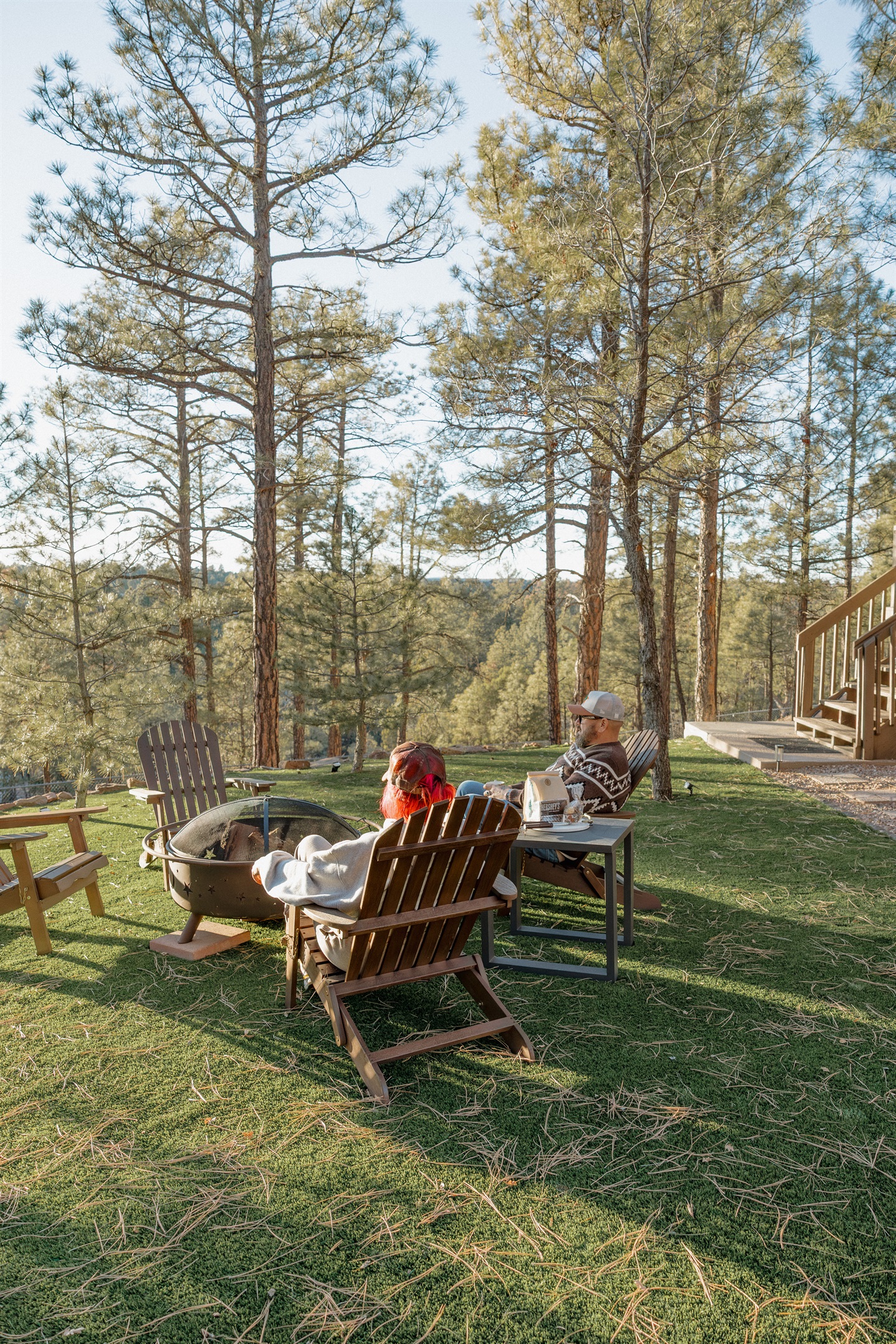 Gather around the fire pit at Poppywood Pines surrounded by towering ponderosa pines. This pet-friendly Show Low cabin offers spacious outdoor space with Adirondack chairs, perfect for s'mores and stargazing after exploring White Mountains hiking and fishi