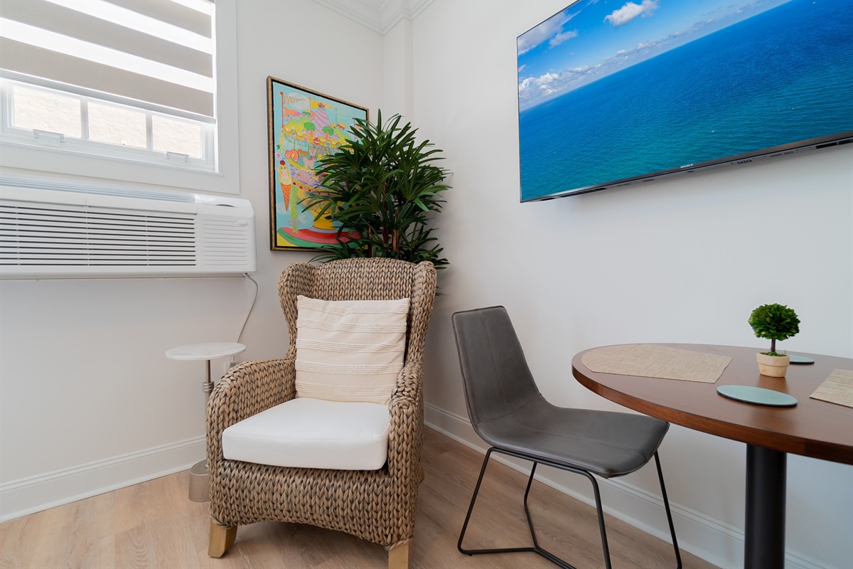 Comfy chair coming soon to relax and read in the corner.  A table for two is waiting for you.