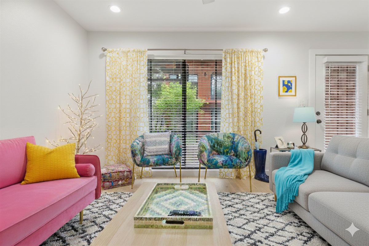 living room has 2 comfy couches and chairs