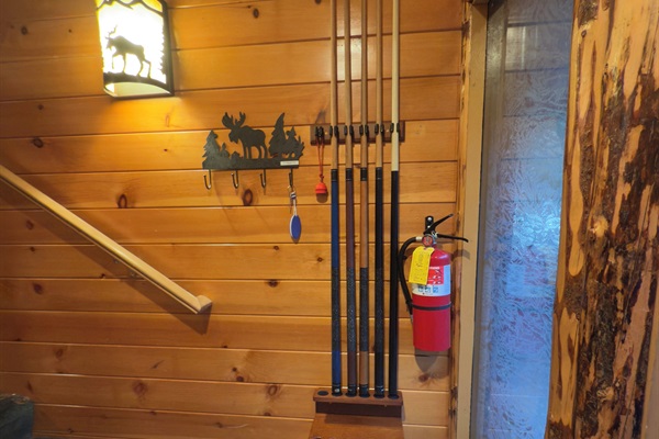 Pool cues, pool balls (on top of dresser under the stairs) and accessories provided (Pool table in club house)