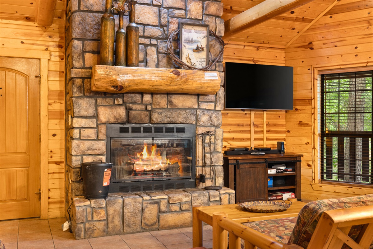 Relax by the fireplace after a day outdoors. Stone hearth and cozy seating make every evening special.