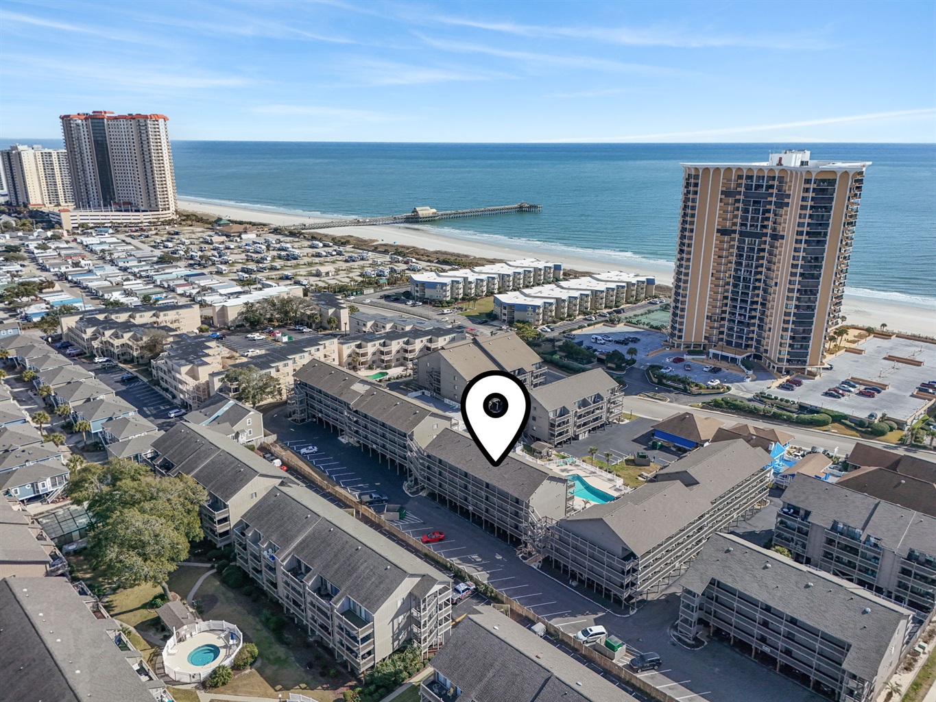 Oceanview condo overlooking multiple pools, walk to the Apache Pier, Resturaunts and so much more! 