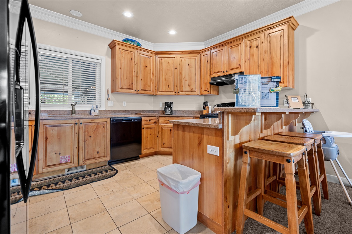 Gourmet kitchen with breakfast bar—perfect for casual dining and morning coffee.