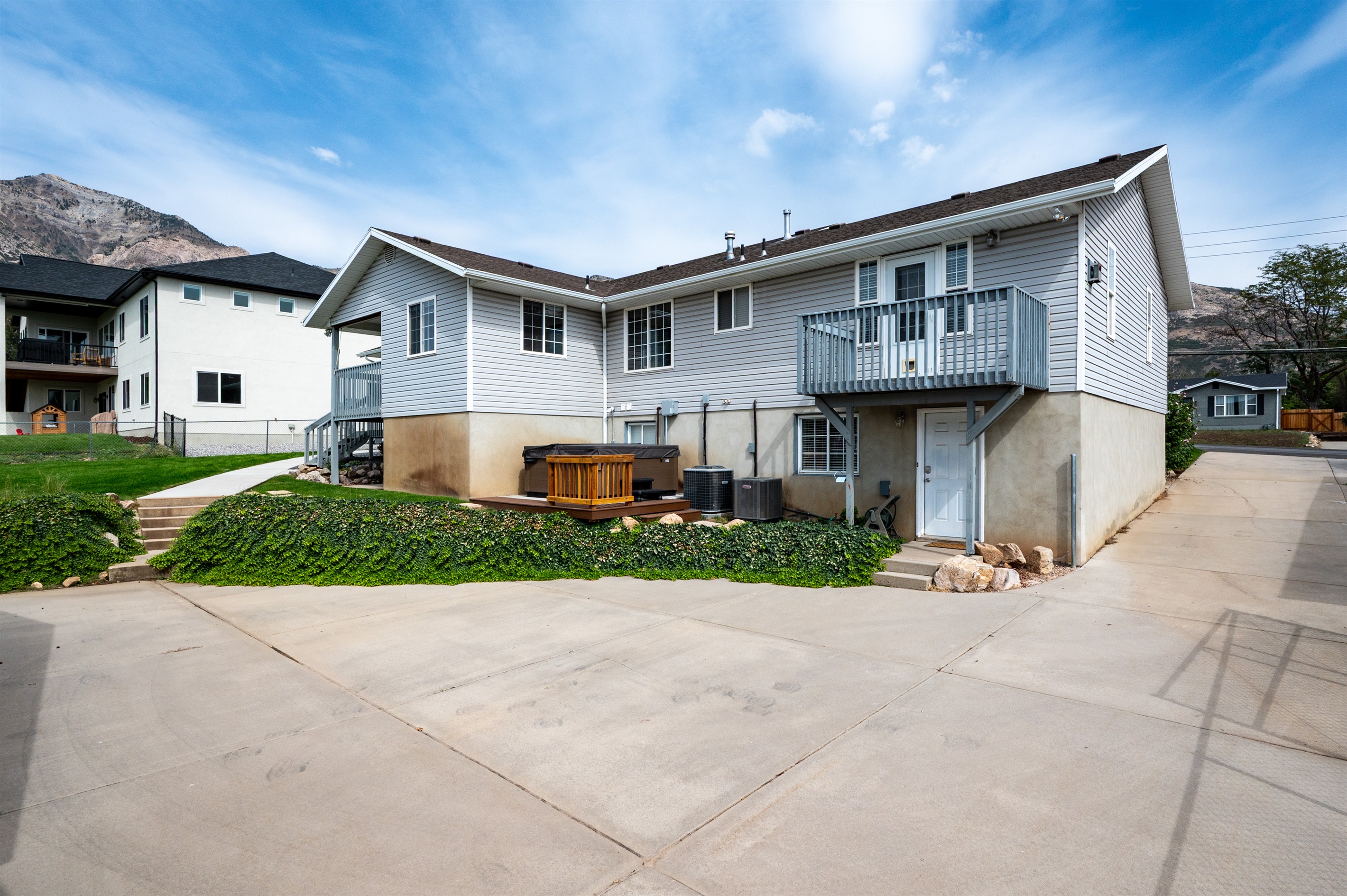 Private hot tub located behind the home with easy access from both the main level and studio entrance.