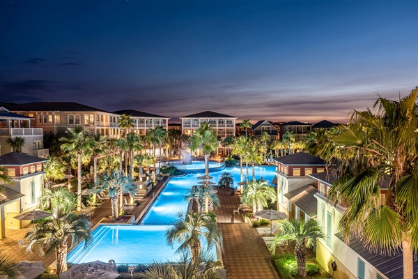 Resort style community pool with pool side cafe, cabanas, lounge chairs