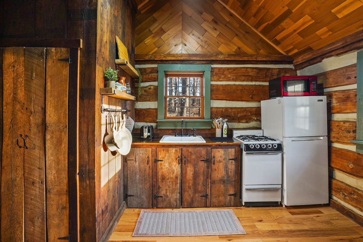 fully equipped kitchen with stove, oven, microwave, and refrigerator - an inviting space to create and savor delicious meals