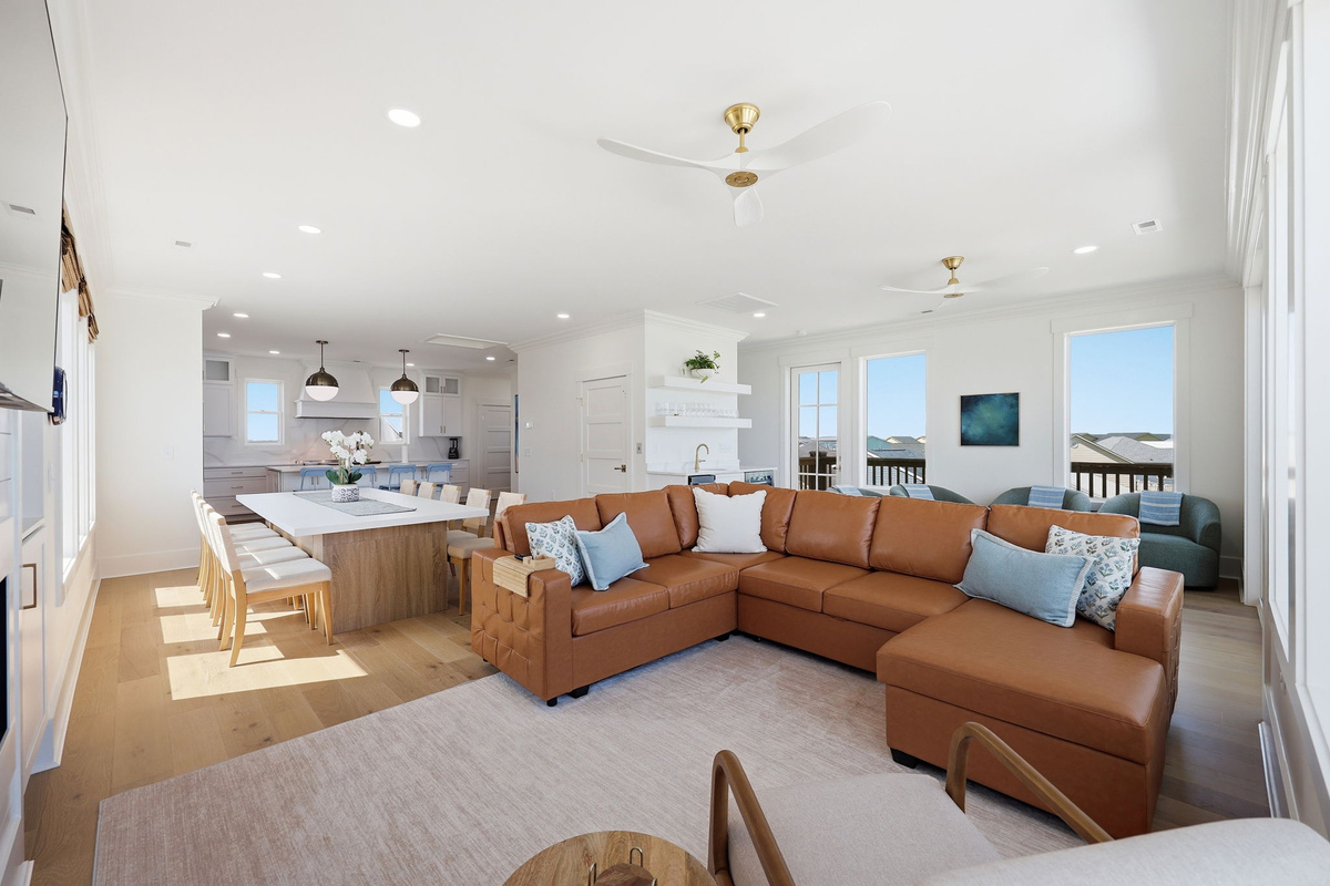 Living and dining spaces designed for effortless oceanfront gatherings with panoramic views from every angle