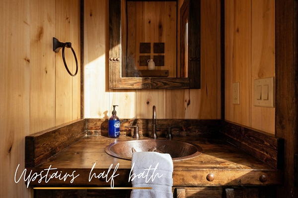 A convenient half bath, perfect for quick refreshes during your stay.