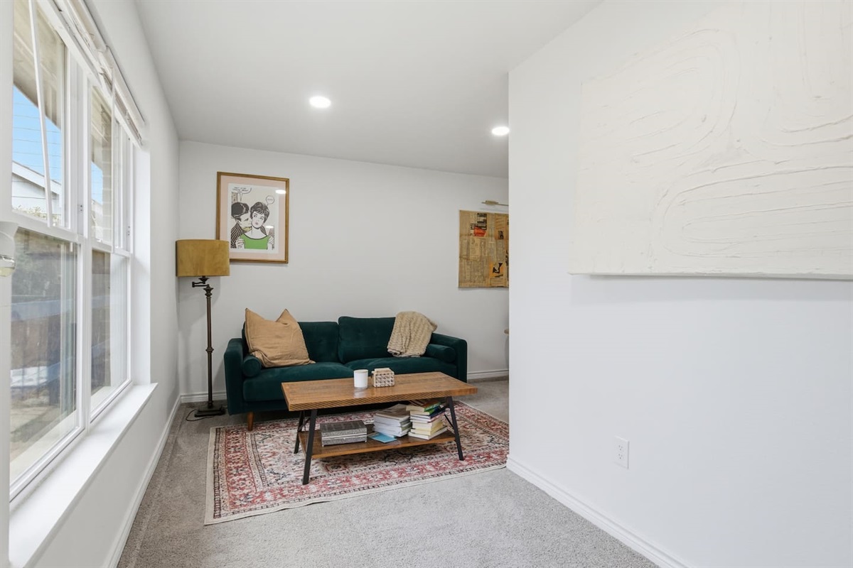 Dedicated workspace with desk, comfortable chair, fast WiFi, and a pull-out sofa futon that sleeps one person comfortably (single size).
