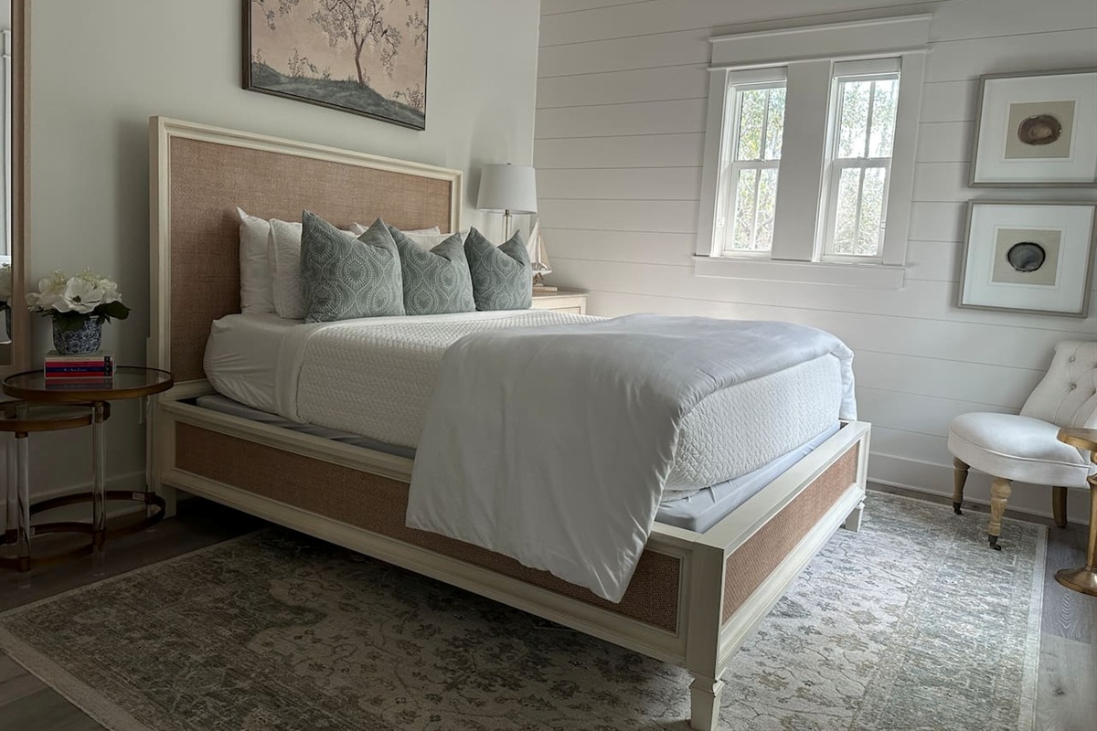 Spacious 2nd level queen bedroom suite with full ensuite bathroom, tiled shower, and a large vanity.