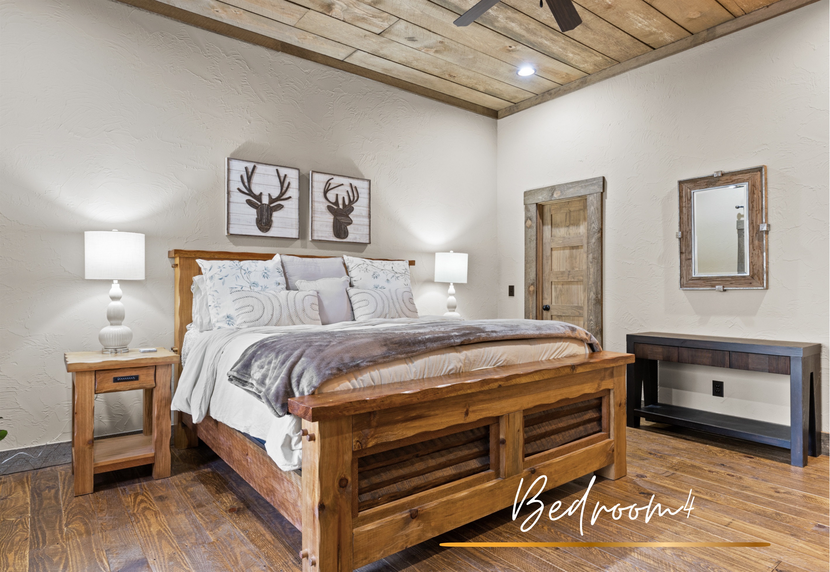 Bedroom 4: This king bedroom blends warmth and style with its cozy decor, vaulted ceilings, and inviting atmosphere.