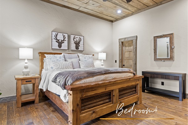 Bedroom 4: This king bedroom blends warmth and style with its cozy decor, vaulted ceilings, and inviting atmosphere.