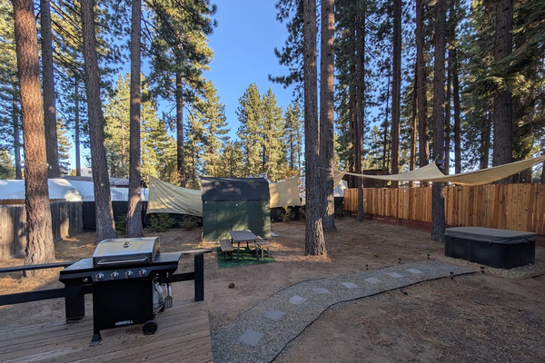 The ultimate mountain getaway awaits in this spacious, pine-sheltered backyard. Fire up the gas grill for an outdoor dinner on the deck, then wind down under the stars in your private hot tub.
