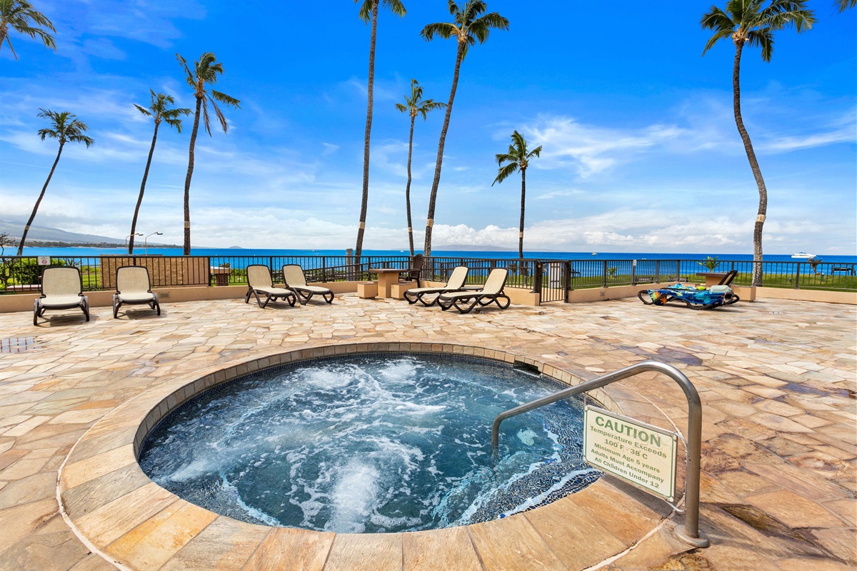 Large oceanfront hot tub with chaise lounges. Best spot to enjoy the sunset afterglow