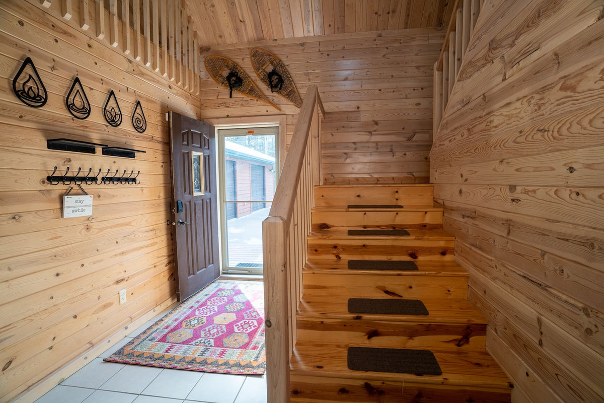 The stairwell leading upstairs is spacious and elegant.  