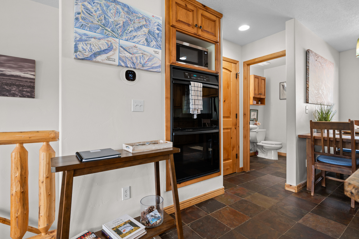 Convenient main-level half bath with rustic accents and thoughtful touches for added guest comfort.