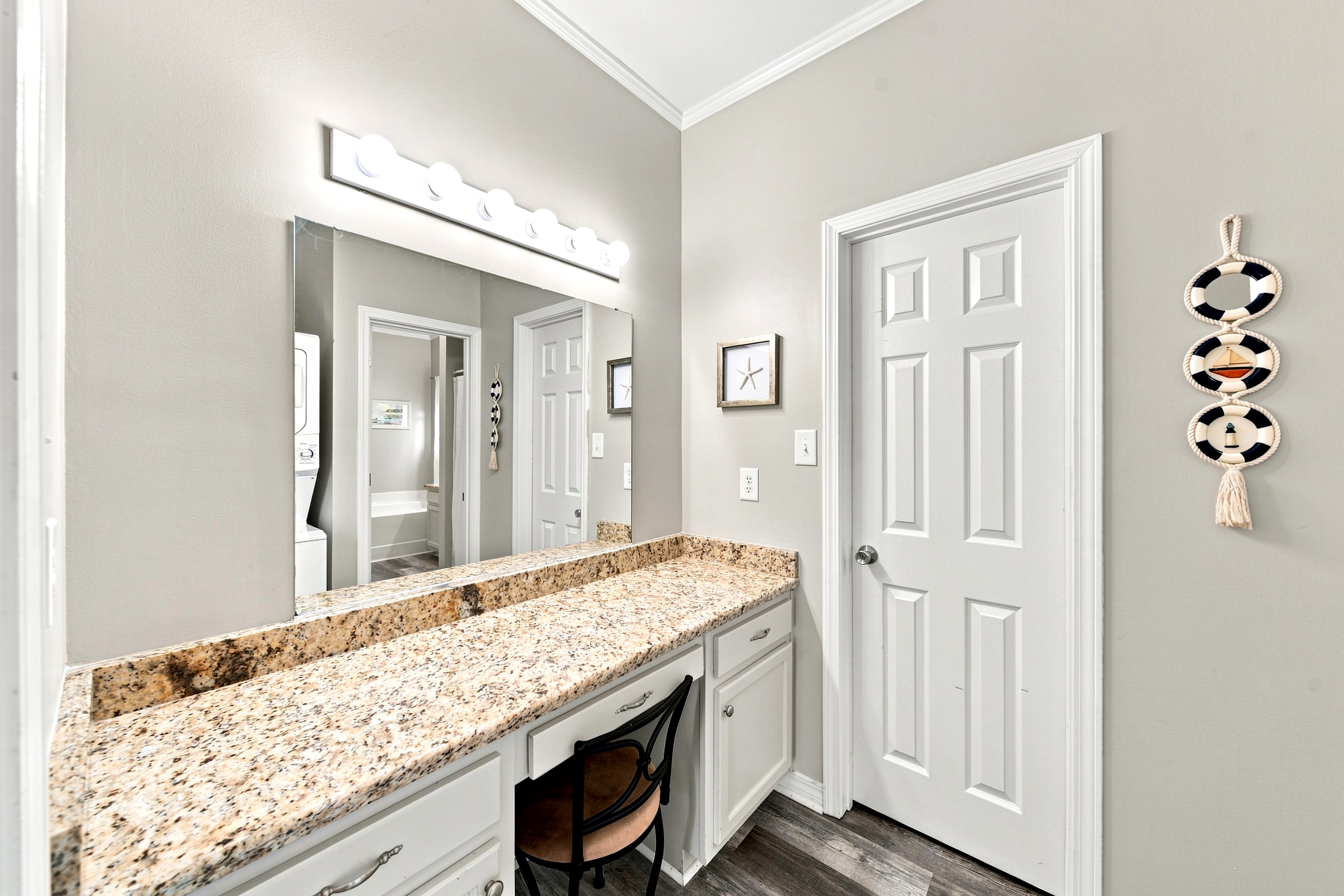 A spacious vanity with granite counters offers plenty of room to get ready for a day on the Gulf Coast.