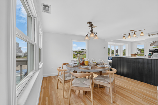 Bright dining and kitchen spaces combine an open layout with beautiful natural light and ocean views.