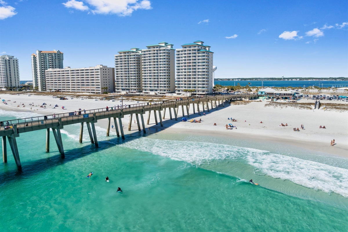 From above, the stunning combination of turquoise water, sandy shoreline, and the iconic pier creates an unforgettable view.