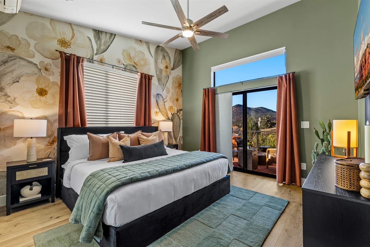 A spacious primary bedroom with a comfortable king bed, natural light, and direct access to the deck - creating a quiet, relaxing place to unwind.