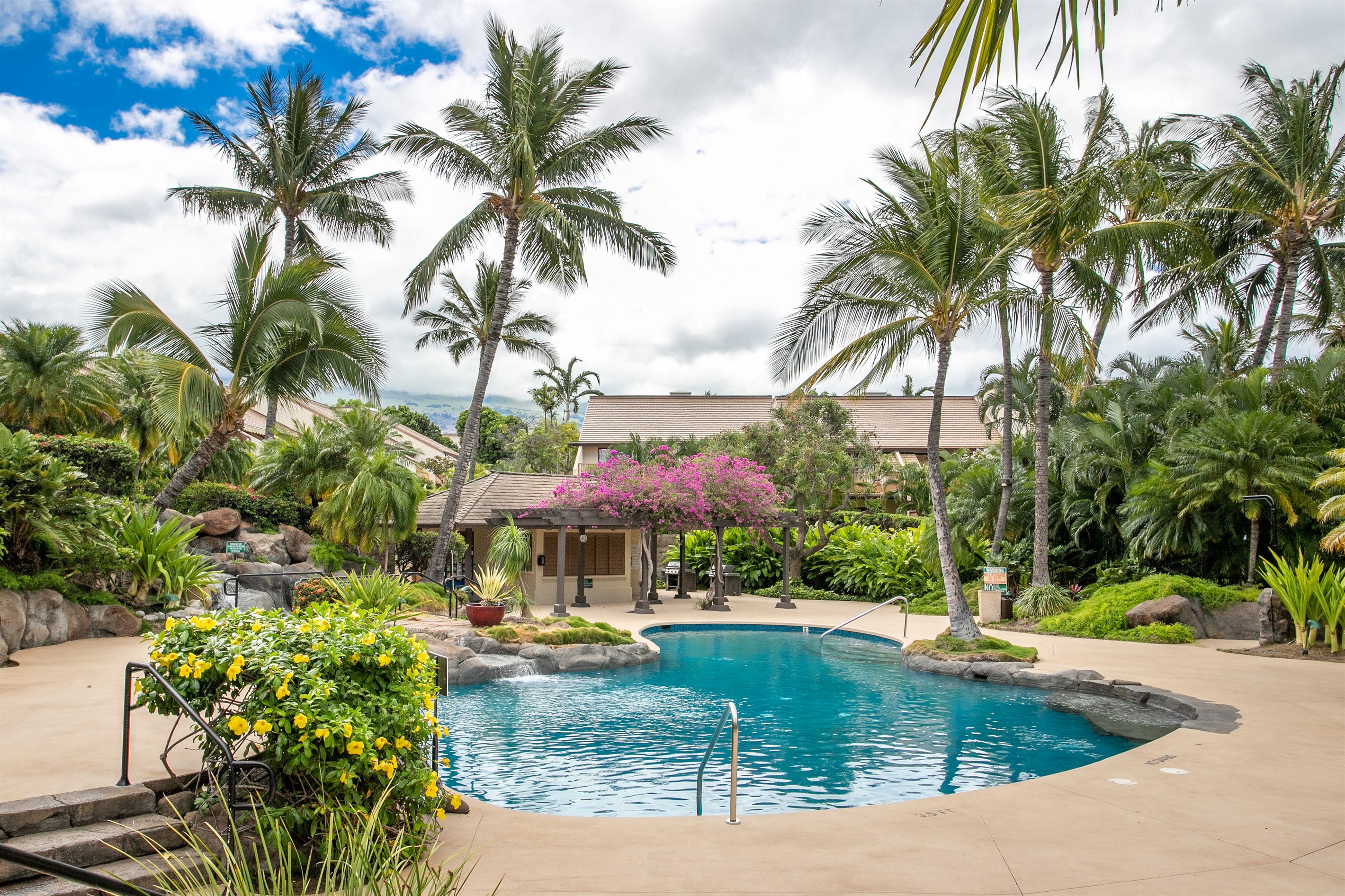 The shallow upper pool and pebble hottub are popular with families
