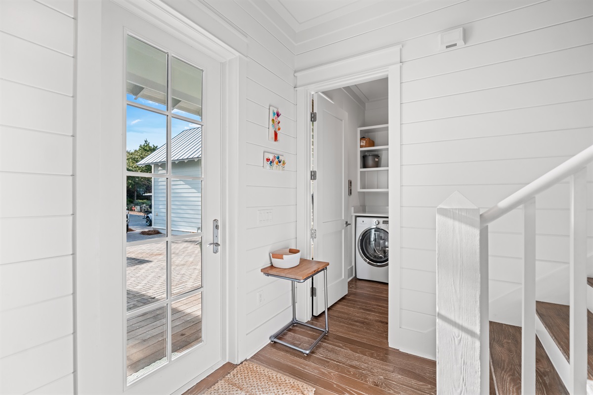 The back entrance offers convenient entry from parking and the back patio space. 