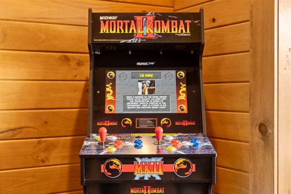 Classic arcade machine in the game room — perfect for kids, teens, and nostalgic adults.