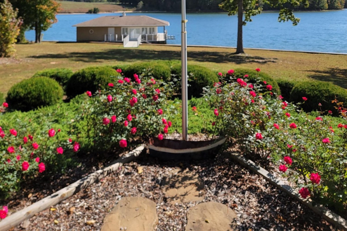 Beautiful rose bushes line the patio, adding a touch of color and charm to your lakefront stay.