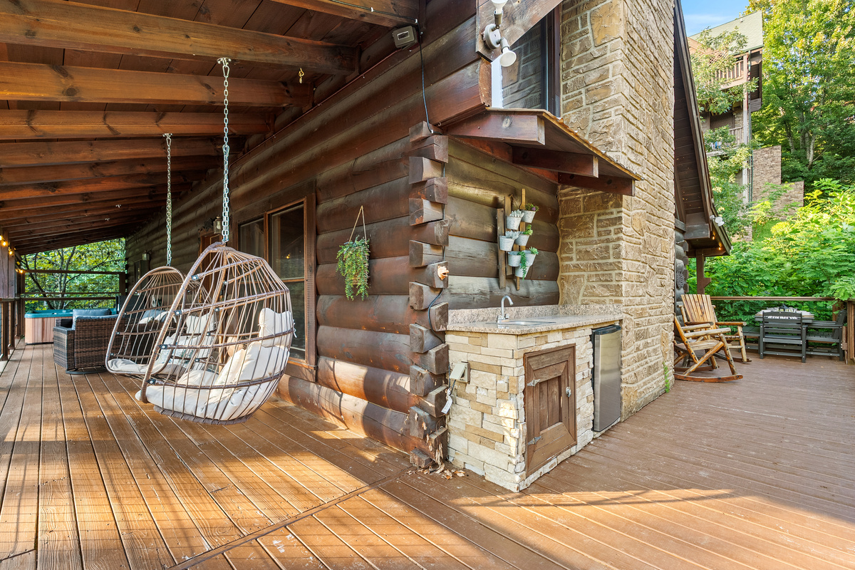 Settle into the hanging basket chairs or prepare refreshments at the outdoor kitchenette, complete with a sink and mini fridge.