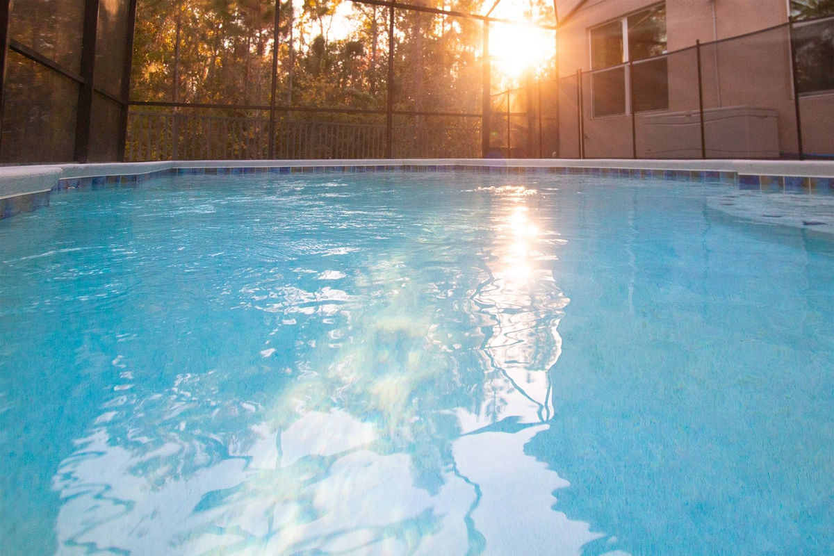 Watch the sun set behind the trees from your Private Screened Pool.