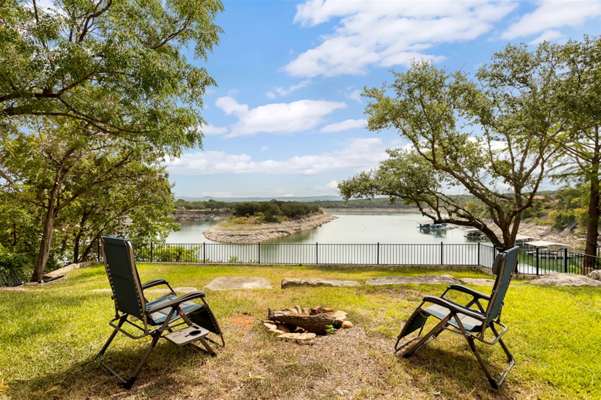 Fire pit area with a lake view