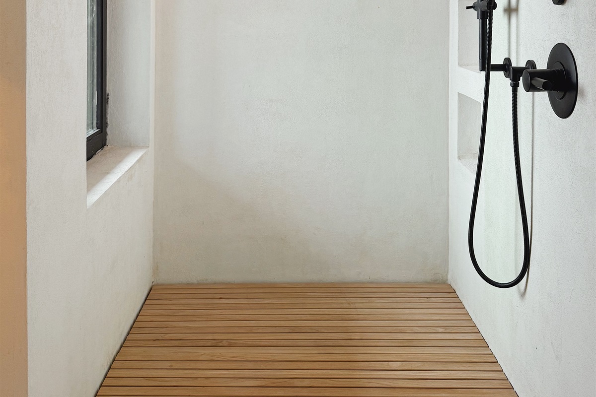 Jason Wu / Brizo shower with mountain views and operable window.