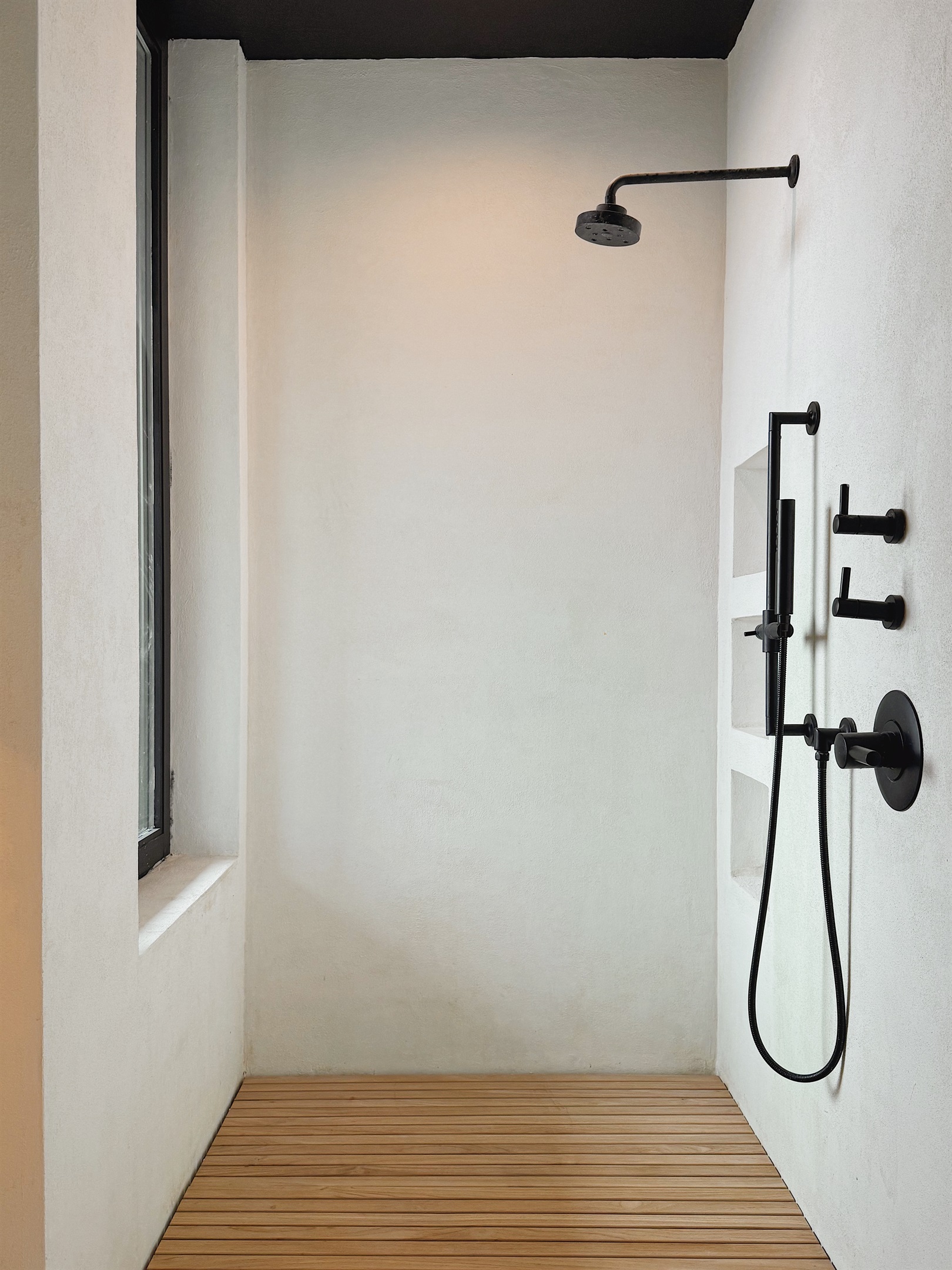 Jason Wu / Brizo shower with mountain views and operable window.