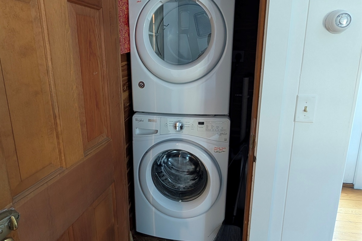 Washer/Dryer area as you go into living room behind the door to the left