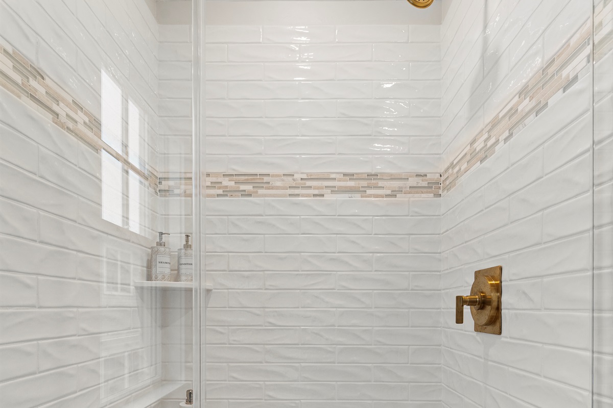 Step into the walk-in shower for a relaxing experience.