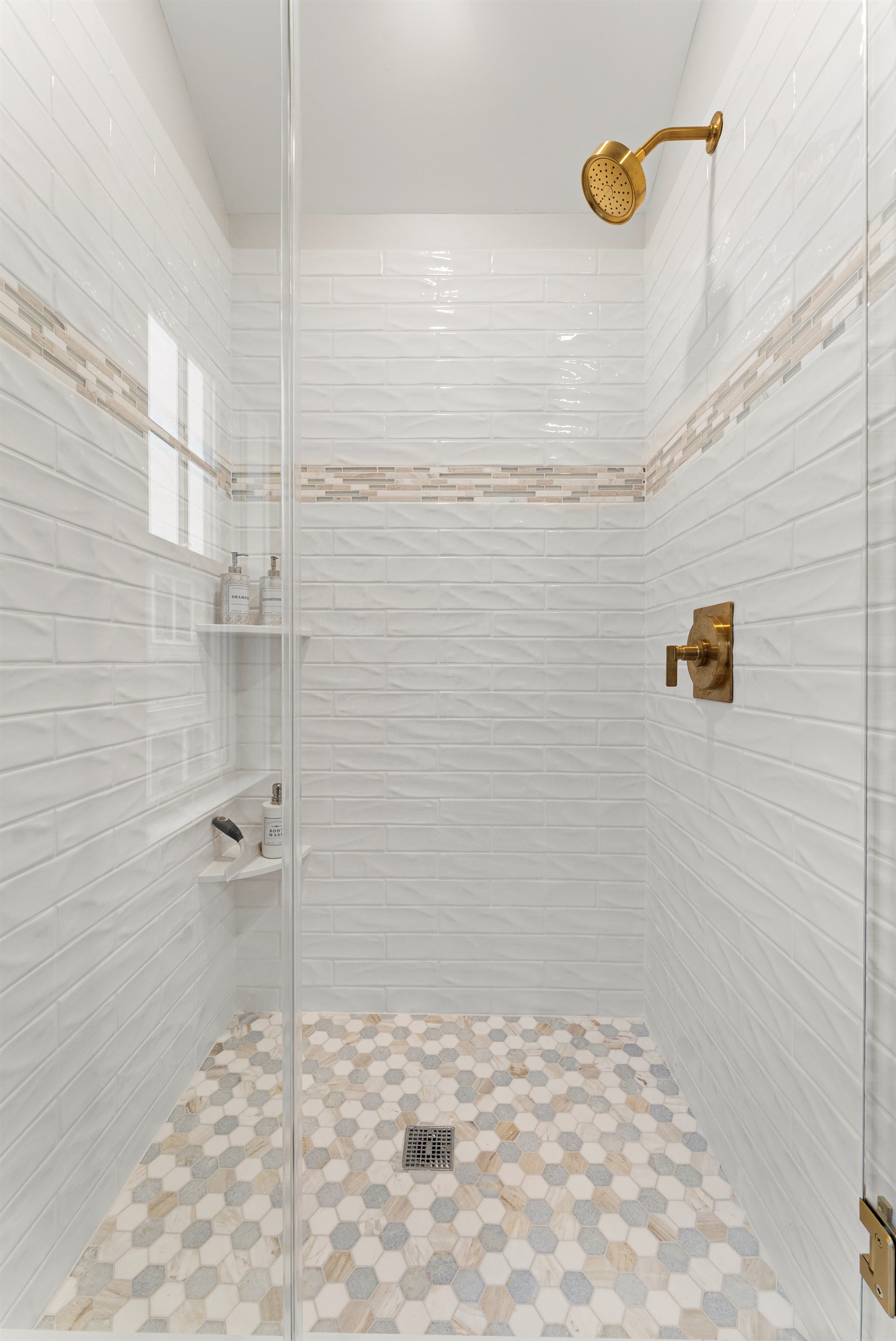 Step into the walk-in shower for a relaxing experience.