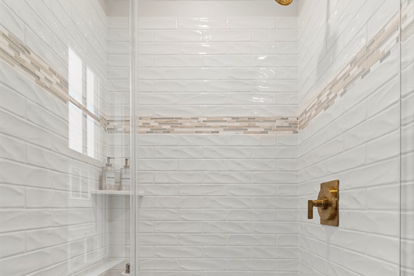 Step into the walk-in shower for a relaxing experience.